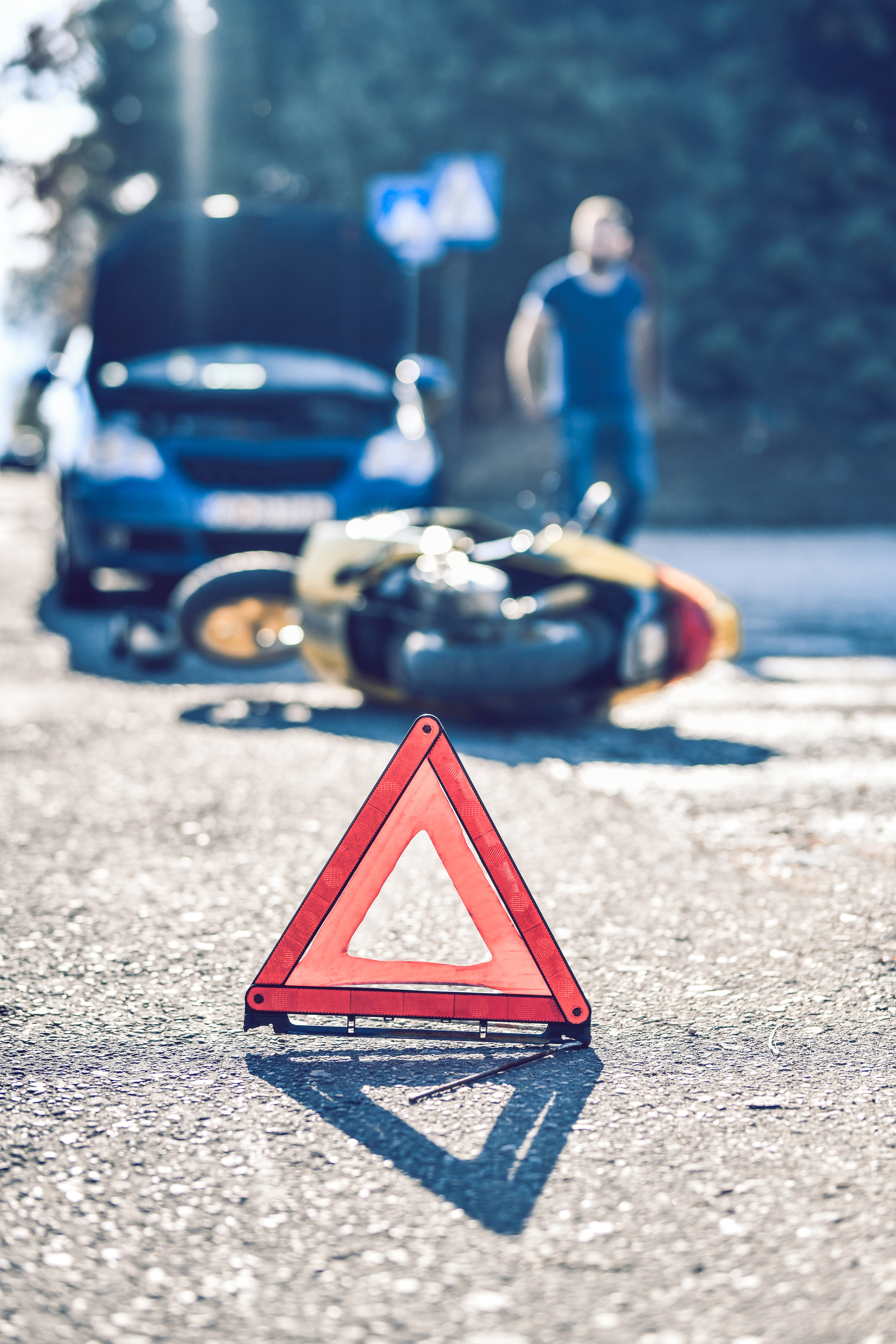 Warning Triangle On A Car And Motorcycle Accident Scene